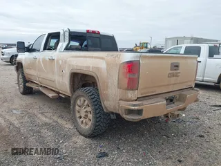 2015 GMC Sierra 2500HD available WiFi Denali with VIN 1GT120E84FF642823, listed as a IAAI auction lot 41593286 with 148,038 mi miles. Bid and sale history available at carsss.com. Image 3.