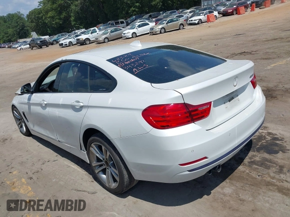 2015 BMW 4 Series 428i with VIN WBA4A5C56FG052023, listed as a IAAI auction lot 40085862 with 90,796 mi miles and . Bid and sale history available at carsss.com. Image 3.