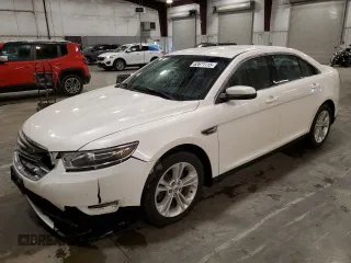2015 Ford Taurus SEL z VIN 1FAHP2H83FG207704, wystawiony jako Copart lot #62671115 z przebiegiem 77 586 mil mil oraz Szkoda całkowita • Salvage title. Historia ofert i sprzedaży dostępna na DreamBid. Obrazek 1.