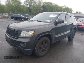 2011 Jeep Grand Cherokee Laredo with VIN 1J4RR4GGXBC604304, listed as a IAAI auction lot 42201742 with 196,483 mi miles and . Bid and sale history available at DreamBid. Image 2.