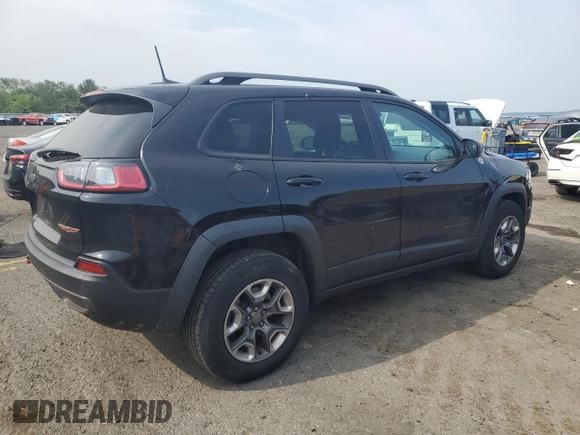 2019 Jeep Cherokee Trailhawk z VIN 1C4PJMBXXKD471338, wystawiony jako Copart lot #59880765 z przebiegiem 59 546 mil mil oraz Szkoda całkowita • Salvage title. Historia ofert i sprzedaży dostępna na DreamBid. Obrazek 3.