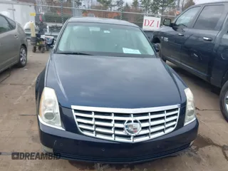2009 Cadillac DTS 1SA z VIN 1G6KD57Y19U137656, wystawiony jako IAAI lot #41531439 z przebiegiem 103 151 mil mil oraz . Historia ofert i sprzedaży dostępna na DreamBid. Obrazek 6.