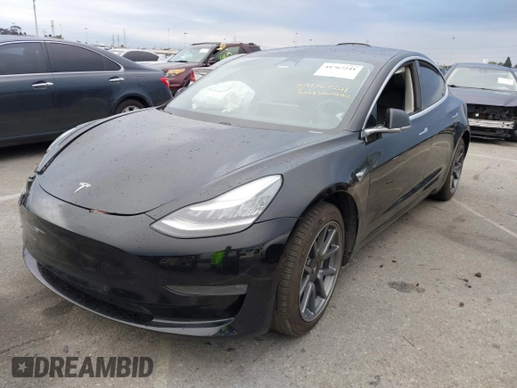 2019 Tesla Model 3 Mid Range with VIN 5YJ3E1EA6KF361808, listed as a IAAI auction lot 41767241 with 96,200 mi miles and . Bid and sale history available at carsss.com. Image 2.