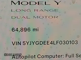 2020 Tesla Model Y Long Range with VIN 5YJYGDEE4LF030103, listed as a IAAI auction lot 41328929 with 64,896 mi miles and . Bid and sale history available at DreamBid. Image 15.