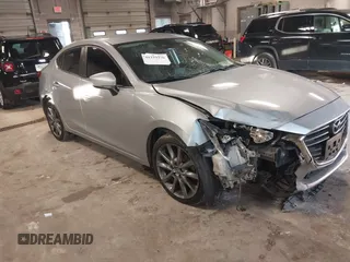 2018 Mazda 3 Touring z VIN 3MZBN1V31JM182757, wystawiony jako IAAI lot #41229296 z przebiegiem 103 233 mil mil oraz . Historia ofert i sprzedaży dostępna na DreamBid. Obrazek 1.
