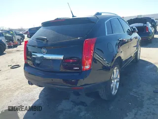 2014 Cadillac SRX Performance Collection z VIN 3GYFNCE35ES517868, wystawiony jako IAAI lot #41775522 z przebiegiem 166 960 mil mil oraz . Historia ofert i sprzedaży dostępna na DreamBid. Obrazek 4.