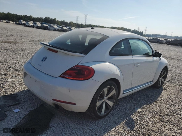 2012 Volkswagen Beetle 2.0T Turbo w/Sun/Sound PZEV with VIN 3VWVA7AT9CM612734, listed as a Copart auction lot 69196224 with 0 mi miles and Salvage Title. Bid and sale history available at carsss.com. Image 3.