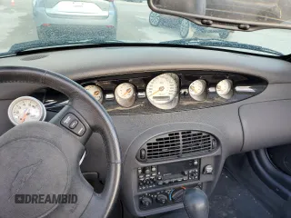 1999 Plymouth Prowler z VIN 1P3EW65G8XV502376, wystawiony jako Copart lot #77556104 z przebiegiem Nie podano mil oraz Szkody całkowita. Historia ofert i sprzedaży dostępna na DreamBid. Obrazek 9.
