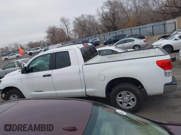 2012 Toyota Tundra z VIN 5TFUM5F11CX039386, wystawiony jako IAAI lot #41472576 z przebiegiem 213 295 mil mil oraz . Historia ofert i sprzedaży dostępna na DreamBid. Obrazek 15.