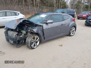 2014 Hyundai Veloster with VIN KMHTC6AD5EU183478, listed as a IAAI auction lot 42107170 with 64,905 mi miles. Bid and sale history available at carsss.com. Image 2.