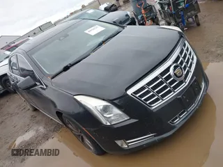 2014 Cadillac XTS Luxury z VIN 2G61M5S34E9192276, wystawiony jako IAAI lot #40928125 z przebiegiem 103 445 mil mil oraz . Historia ofert i sprzedaży dostępna na DreamBid. Obrazek 1.