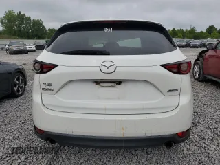 2019 Mazda CX-5 Grand Touring with VIN JM3KFADM6K1581261, listed as a Copart auction lot 59965175 with 127,837 mi miles and Salvage title. Bid and sale history available at DreamBid. Image 6.