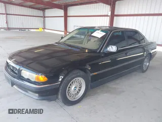 1999 BMW 7 Series 740il with VIN WBAGH8336XDP03839, listed as a IAAI auction lot 42067133 with 163,345 mi miles. Bid and sale history available at carsss.com. Image 2.