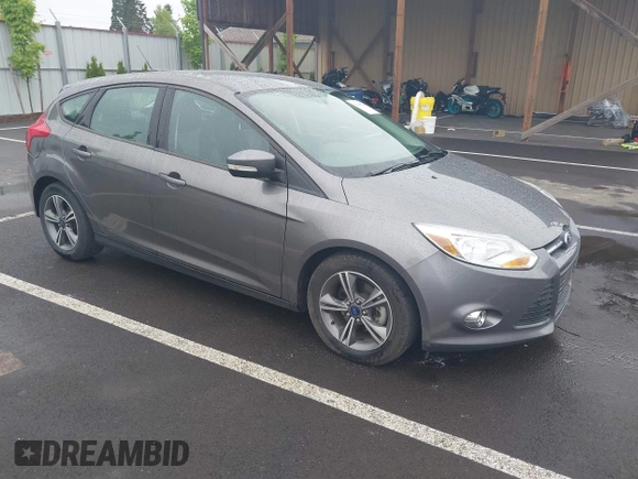 2014 Ford Focus SE with VIN 1FADP3K21EL462169, listed as a IAAI auction lot 42145524 with 100,156 mi miles. Bid and sale history available at carsss.com. Image 1.