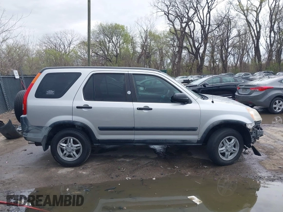 2002 Honda CR-V LX z VIN JHLRD78402C077631, wystawiony jako IAAI lot #41918750 z przebiegiem 186 827 mil mil oraz . Historia ofert i sprzedaży dostępna na DreamBid. Obrazek 13.