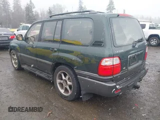 2000 Lexus LX with VIN JT6HT00W3Y0124104, listed as a IAAI auction lot 41493749 with 253,161 mi miles. Bid and sale history available at carsss.com. Image 3.