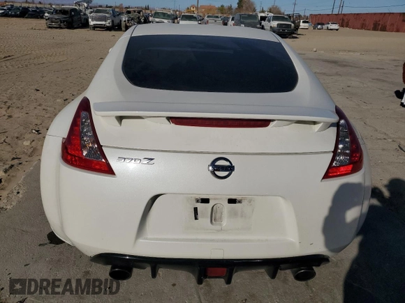 2014 Nissan 370Z Nismo with VIN JN1AZ4EH0EM635111, listed as a Copart auction lot 87292134 with 185,356 mi miles and Salvage Title. Bid and sale history available at DreamBid. Image 6.
