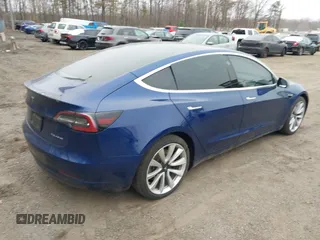 2019 Tesla Model 3 Long Range with VIN 5YJ3E1EB9KF454007, listed as a IAAI auction lot 41769346 with 141,609 mi miles. Bid and sale history available at carsss.com. Image 4.