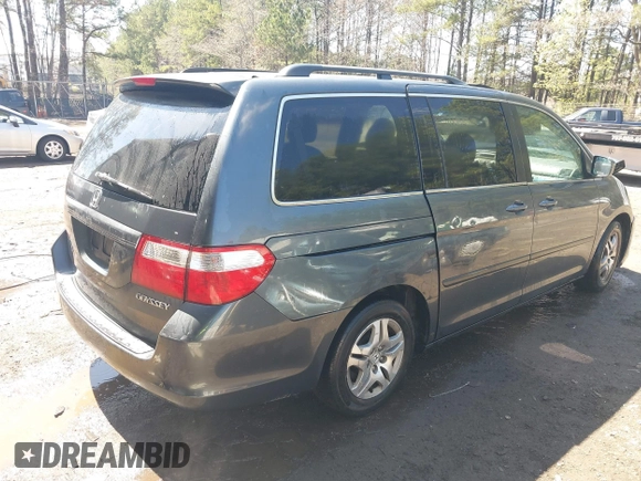 2005 Honda Odyssey EX-L with VIN 5FNRL387X5B069823, listed as a IAAI auction lot 41883007 with 267,250 mi miles and . Bid and sale history available at DreamBid. Image 4.