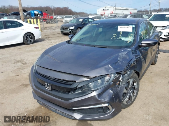 2019 Honda Civic LX with VIN 19XFC2F61KE037495, listed as a IAAI auction lot 41891007 with 90,262 mi miles and . Bid and sale history available at DreamBid. Image 2.