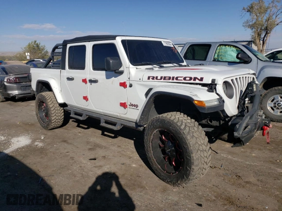 2020 Jeep Gladiator Rubicon with VIN 1C6JJTBG7LL152204, listed as a Copart auction lot 83525554 with 7,030 mi miles and Salvage title. Bid and sale history available at DreamBid. Image 4.
