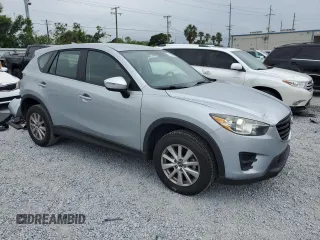 2016 Mazda CX-5 Sport with VIN JM3KE4BY1G0799275, listed as a Copart auction lot 51202355 with 98,409 mi miles and Non Repairable. Bid and sale history available at carsss.com. Image 4.