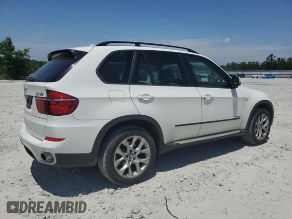 2012 BMW X5 35i z VIN 5UXZV4C54CL990840, wystawiony jako Copart lot #57715245 z przebiegiem 166 192 mil mil oraz Szkoda całkowita • Salvage title. Historia ofert i sprzedaży dostępna na DreamBid. Obrazek 3.