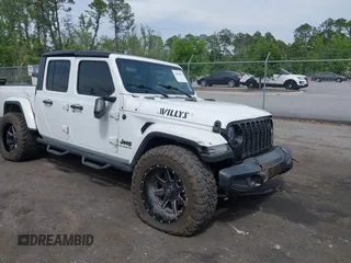 2022 Jeep Gladiator Willys Sport z VIN 1C6HJTAG1NL144540, wystawiony jako IAAI lot #42098624 z przebiegiem 70 376 mil mil oraz . Historia ofert i sprzedaży dostępna na DreamBid. Obrazek 1.