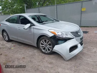 2014 Hyundai Azera Limited z VIN KMHFH4JG3EA409614, wystawiony jako IAAI lot #42292933 z przebiegiem Nie podano mil oraz . Historia ofert i sprzedaży dostępna na DreamBid. Obrazek 1.