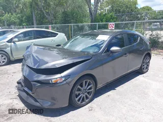 2022 Mazda 3 Select z VIN JM1BPAKL1N1519383, wystawiony jako IAAI lot #39742243 z przebiegiem 20 080 mil mil oraz . Historia ofert i sprzedaży dostępna na DreamBid. Obrazek 2.