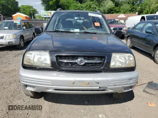 1999 Suzuki Grand Vitara z VIN JS3TD62VXX4100236, wystawiony jako Copart lot #57228075 z przebiegiem Nie podano mil oraz Szkody całkowita. Historia ofert i sprzedaży dostępna na DreamBid. Obrazek 5.