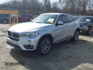 2019 BMW X6 xDrive35i with VIN 5UXKU2C52K0Z63984, listed as a IAAI auction lot 41612265 with 65,634 mi miles. Bid and sale history available at carsss.com. Image 2.