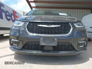 2023 Chrysler Pacifica Touring L with VIN 2C4RC1BG1PR550628, listed as a IAAI auction lot 42553430 with 61,773 mi miles and . Bid and sale history available at DreamBid. Image 19.