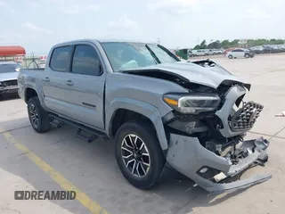2021 Toyota Tacoma SR5 with VIN 5TFAZ5CN1MX112477, listed as a IAAI auction lot 42179554 with 73,911 mi miles and . Bid and sale history available at DreamBid. Image 1.