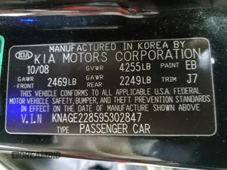 2009 Kia Optima LX z VIN KNAGE228595302847, wystawiony jako Copart lot #59187765 z przebiegiem 235 667 mil mil oraz Czysty tytuł • Clean title. Historia ofert i sprzedaży dostępna na DreamBid. Obrazek 13.