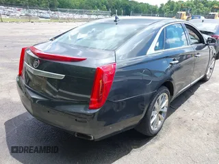 2013 Cadillac XTS Luxury z VIN 2G61P5S34D9109189, wystawiony jako IAAI lot #42242533 z przebiegiem 178 234 mil mil oraz . Historia ofert i sprzedaży dostępna na DreamBid. Obrazek 4.
