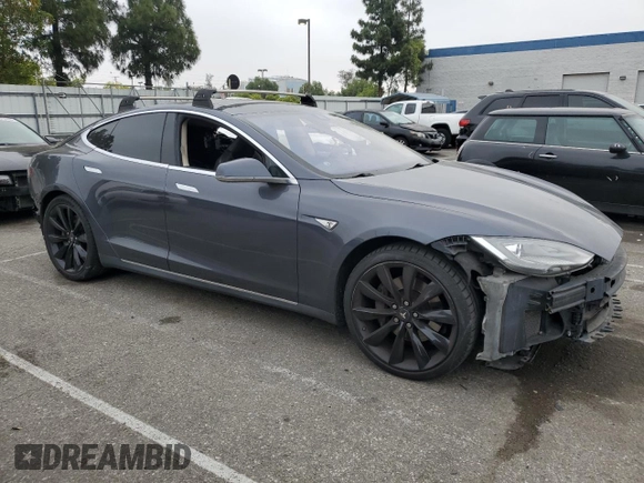 2014 Tesla Model S 60 with VIN 5YJSA1S14EFP56277, listed as a Copart auction lot 57162685 with Not provided miles and Salvage title. Bid and sale history available at DreamBid. Image 4.