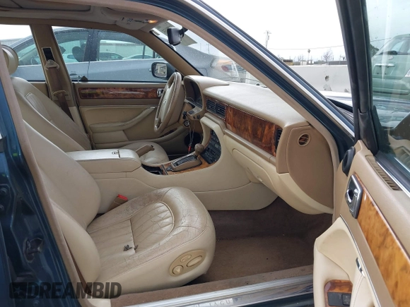 1996 Jaguar XJ with VIN SAJHX1743TC759842, listed as a IAAI auction lot 41778155 with 189,315 mi miles and . Bid and sale history available at DreamBid. Image 5.