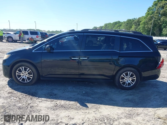 2011 Honda Odyssey EX-L with VIN 5FNRL5H67BB087064, listed as a IAAI auction lot 42326427 with 177,795 mi miles and . Bid and sale history available at DreamBid. Image 14.