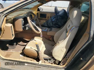 1987 Pontiac Fiero GT z VIN 1G2PG1194HP216891, wystawiony jako Copart lot #72103234 z przebiegiem 55 013 mil mil oraz Tytuł czysty. Historia ofert i sprzedaży dostępna na DreamBid. Obrazek 7.