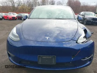 2023 Tesla Model Y Long Range z VIN 7SAYGDEE2PF694974, wystawiony jako IAAI lot #41814582 z przebiegiem 31 726 mil mil oraz . Historia ofert i sprzedaży dostępna na DreamBid. Obrazek 20.