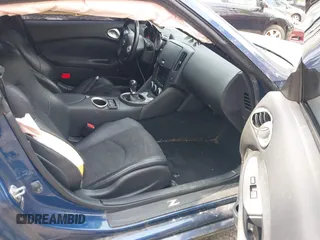 2014 Nissan 370Z Nismo z VIN JN1AZ4EH0EM631950, wystawiony jako IAAI lot #41685567 z przebiegiem 103 282 mil mil oraz . Historia ofert i sprzedaży dostępna na DreamBid. Obrazek 5.