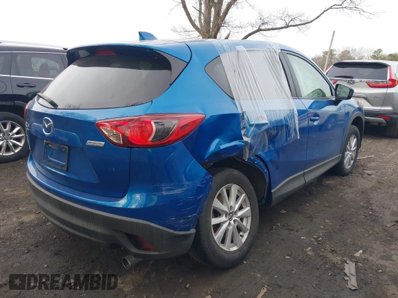 2013 Mazda CX-5 Touring with VIN JM3KE4CE0D0160711, listed as a IAAI auction lot 41843658 with 65,391 mi miles. Bid and sale history available at carsss.com. Image 4.