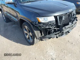 2014 Jeep Grand Cherokee Overland with VIN 1C4RJECG4EC523747, listed as a IAAI auction lot 40802143 with 124,079 mi miles. Bid and sale history available at carsss.com. Image 18.