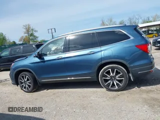 2020 Honda Pilot Touring 8-Passenger with VIN 5FNYF6H93LB034009, listed as a IAAI auction lot 42090993 with 73,325 mi miles and . Bid and sale history available at carsss.com. Image 14.