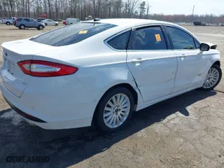 2015 Ford Fusion Energi SE Luxury with VIN 3FA6P0PU0FR272349, listed as a IAAI auction lot 41844130 with 140,353 mi miles. Bid and sale history available at carsss.com. Image 4.