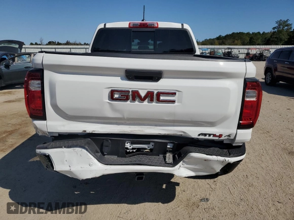 2023 GMC Canyon 4WD AT4X with VIN 1GTP6EEK6P1235222, listed as a Copart auction lot 75664684 with 9,736 mi miles and Salvage Title. Bid and sale history available at carsss.com. Image 6.