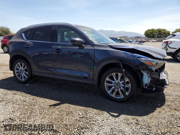 2020 Mazda CX-5 Grand Touring z VIN JM3KFADM4L0794765, wystawiony jako Copart lot #63850005 z przebiegiem 53 270 mil mil oraz Szkoda całkowita • Salvage title. Historia ofert i sprzedaży dostępna na DreamBid. Obrazek 4.