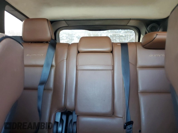 2015 Jeep Grand Cherokee Summit with VIN 1C4RJFJG0FC700014, listed as a Copart auction lot 42981765 with 144,937 mi miles and Salvage Title. Bid and sale history available at DreamBid. Image 10.