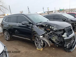 2021 Cadillac XT6 Premium Luxury z VIN 1GYKPDRS9MZ120150, wystawiony jako IAAI lot #41715368 z przebiegiem 47 835 mil mil oraz . Historia ofert i sprzedaży dostępna na DreamBid. Obrazek 14.